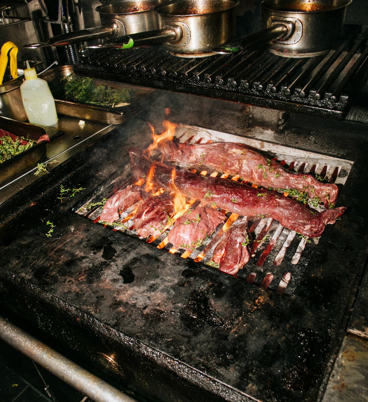 Open flame grilling in the kitchen at Straker's restaurant London